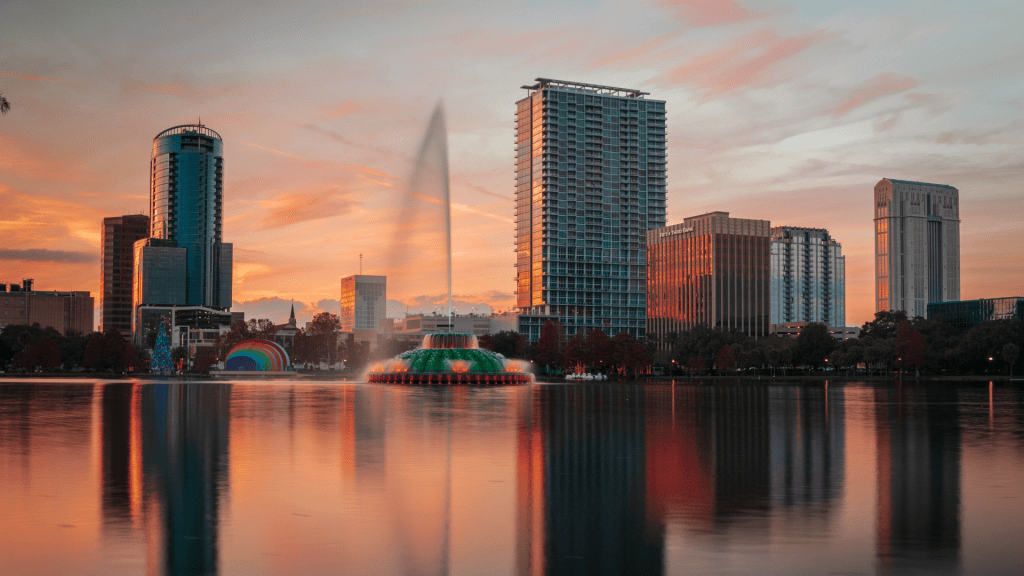 photo of Lake Eola in Orlando, FL. photo of Downtown Orlando at sunset. sunset photo of Lake Eola in Downtown Orlando FL.